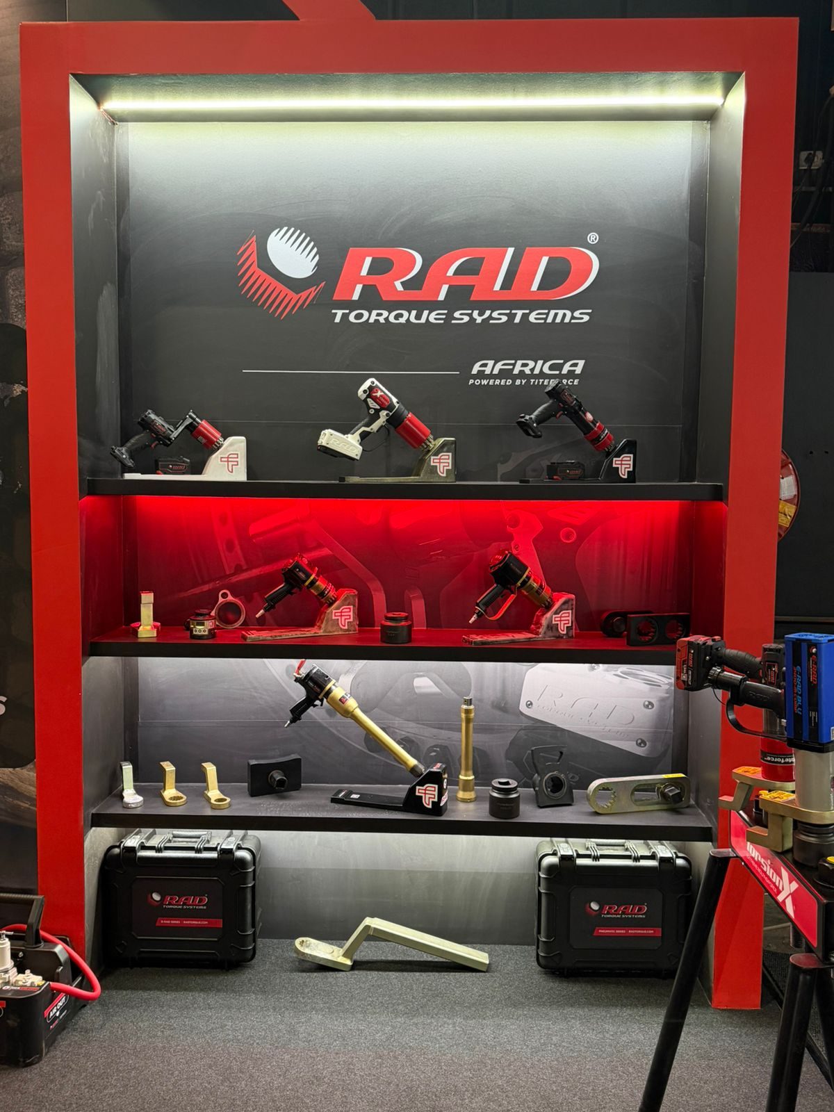 RAD Torque Systems Africa product display wall with battery and pneumatic torque tools