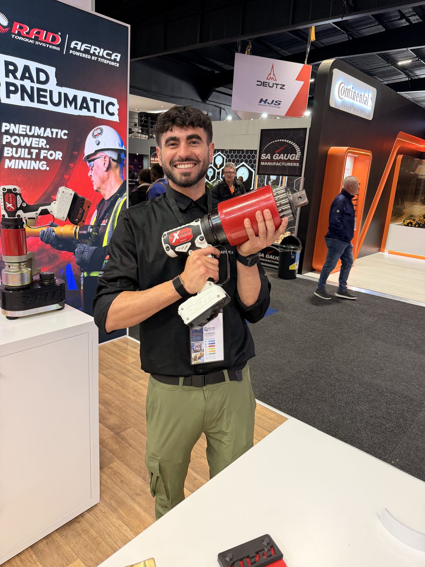 Titeforce team member holding a B-RAD Xtreme battery torque tool